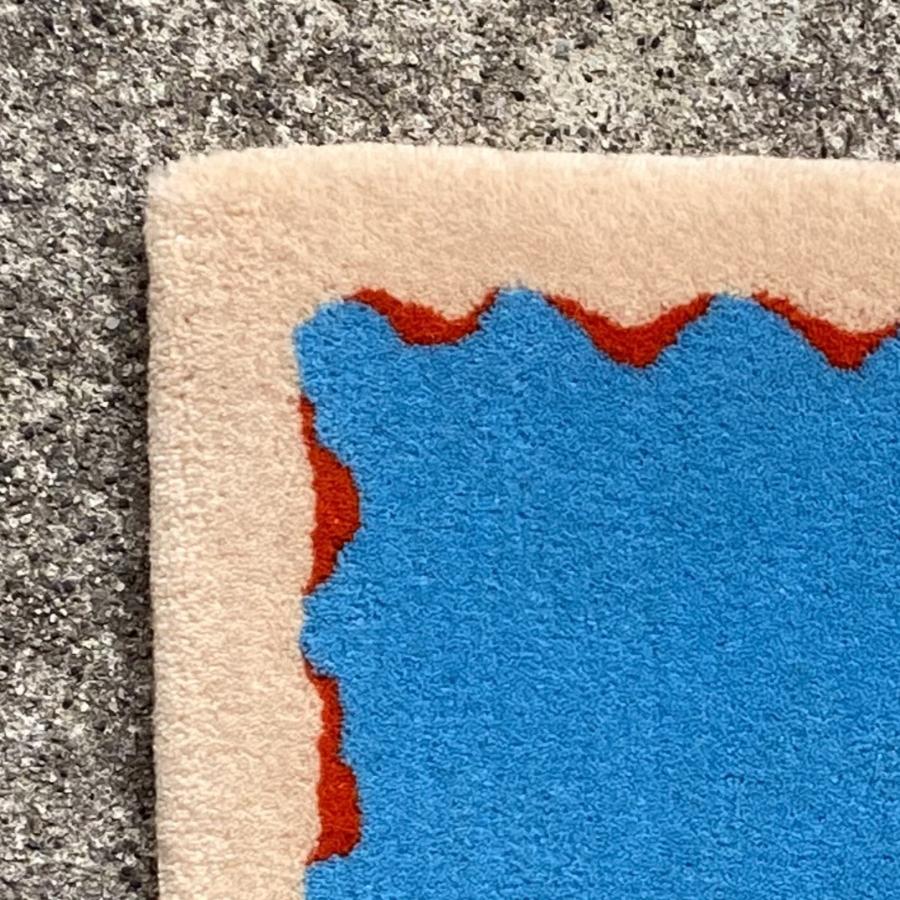 ＜米沢緞通・滝沢工房＞かさなり・水色×オレンジ（スツールラグ：約30×40cm）